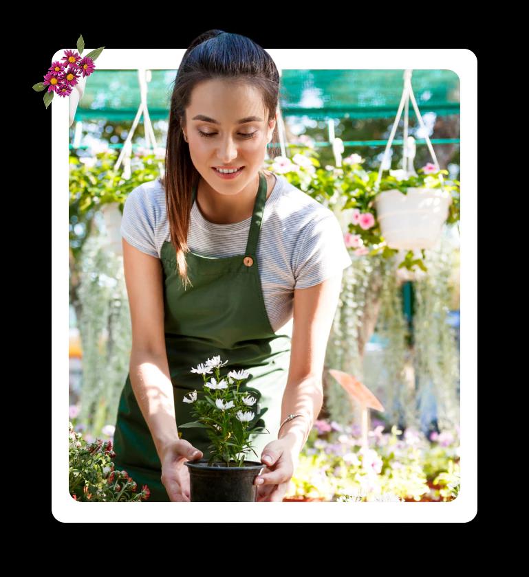 Nursery worker with plant