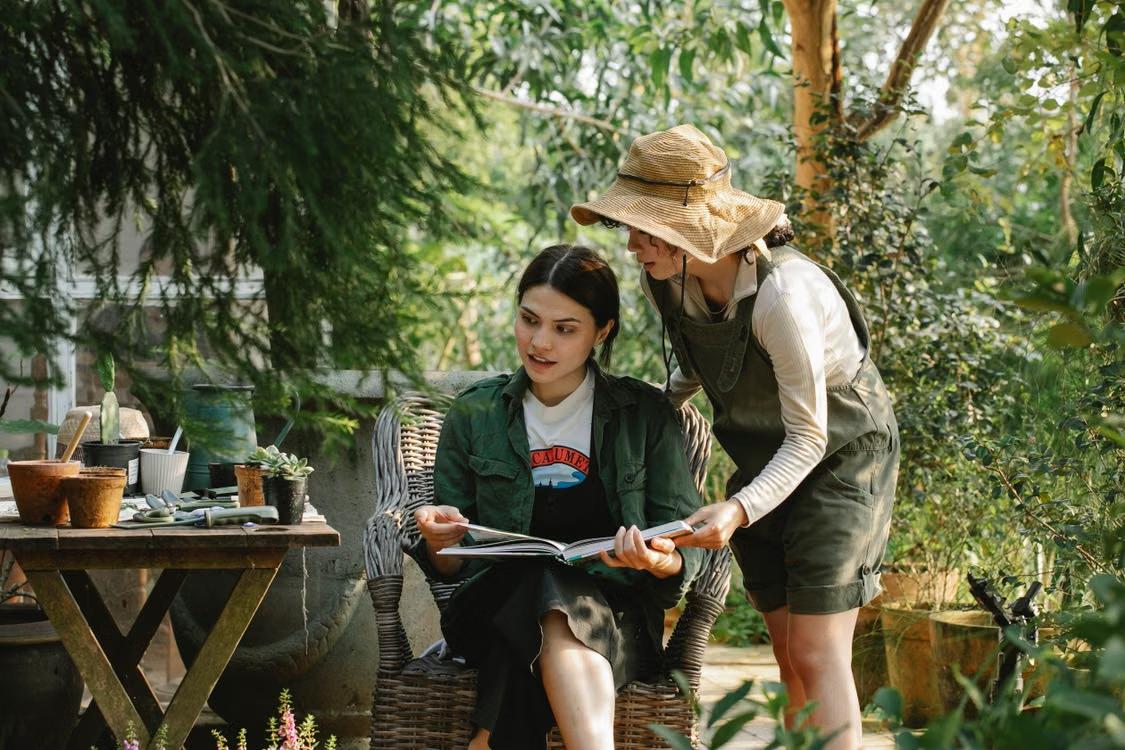 a plant expert helping out a person with gardening information